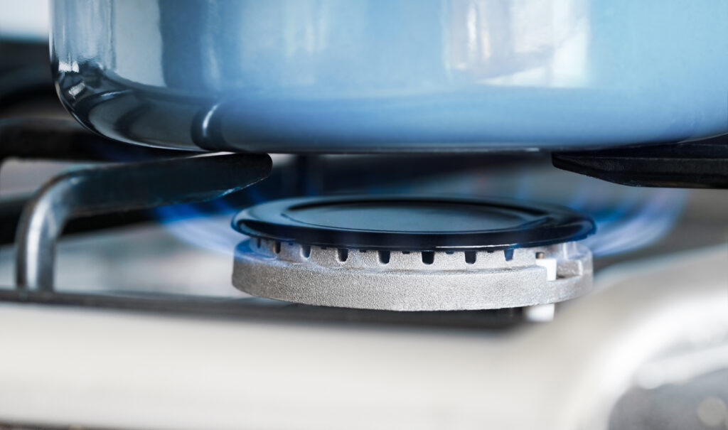 Pan stands gas stove closeup