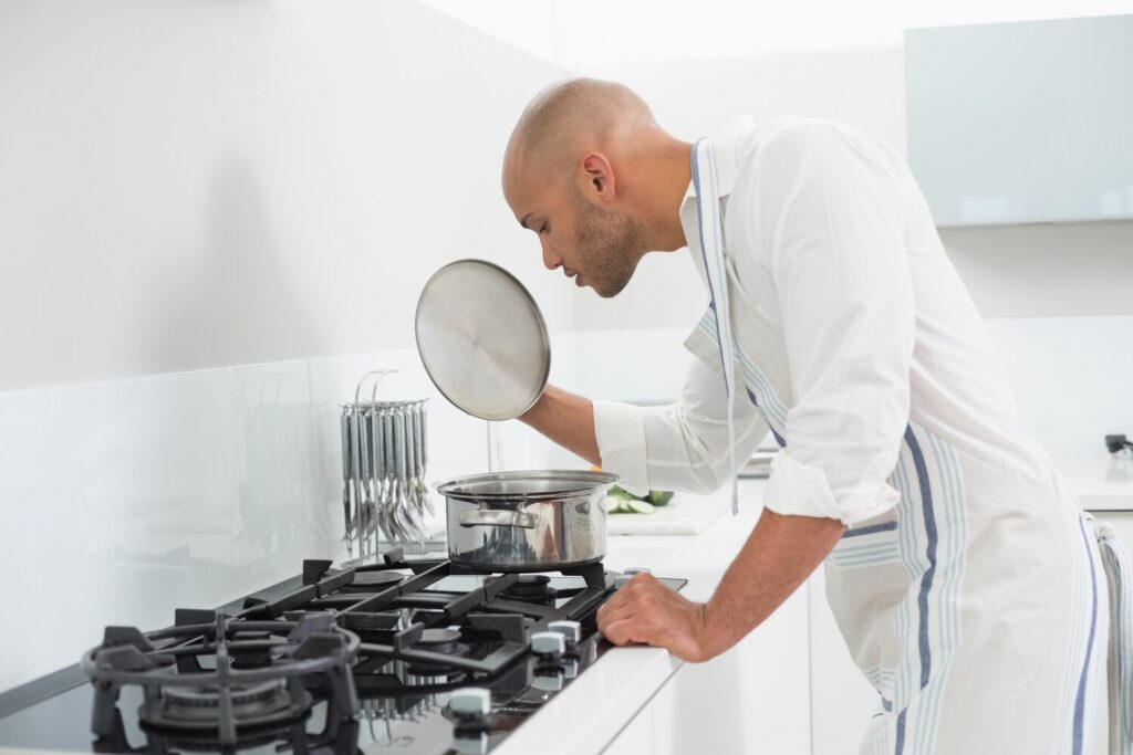 Young man preparing food kitchen 13339 17205 Young man preparing food kitchen 13339 17205