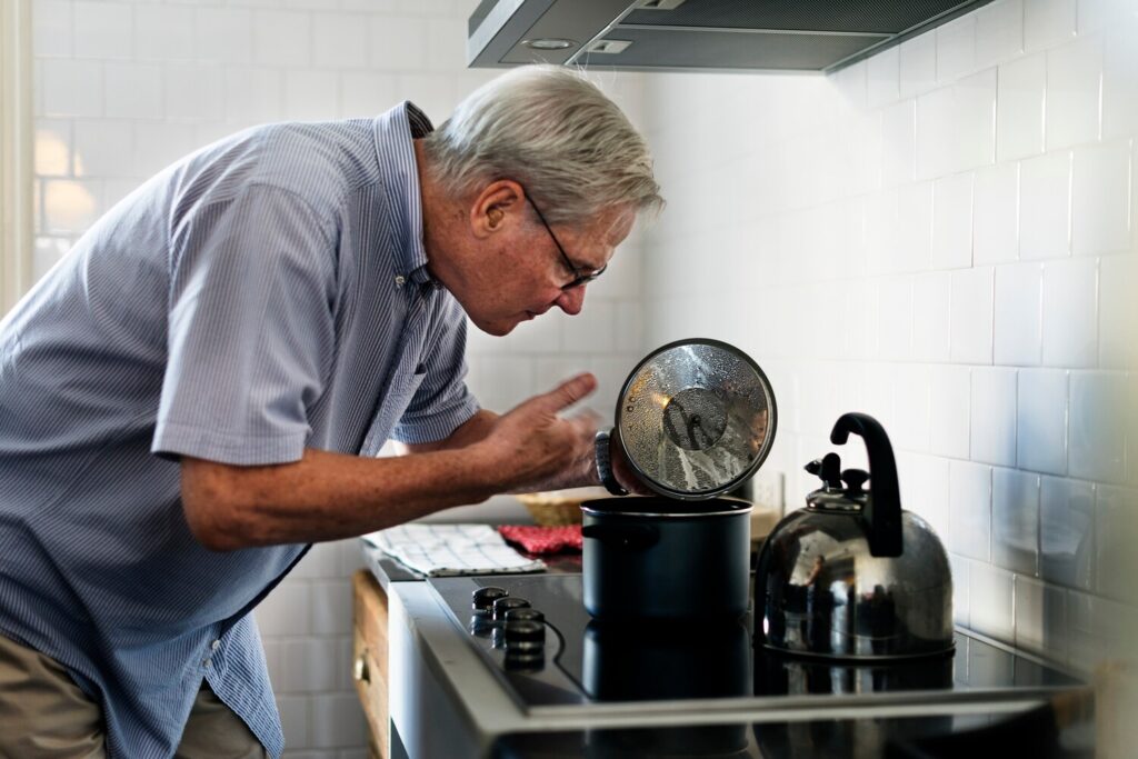 Senior man cooking food kitchen 53876 42065